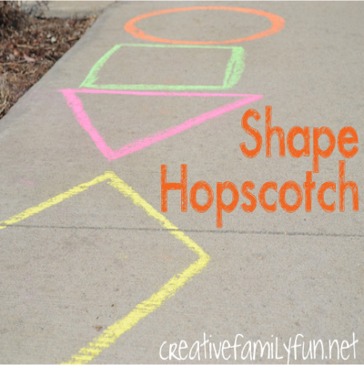 Shapes drawn on the street and “Shape Hopscotch” written on the side