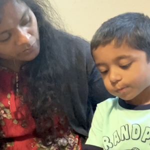A boy and a woman looking down