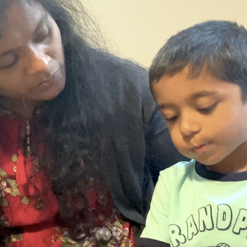 A boy and a woman looking down